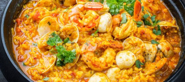 Traditional Portuguese arroz caldoso con almejas with shrimps